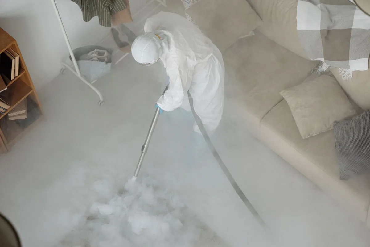 Biohazard cleanup technician in protective equipment, Gnadenhutten, OH